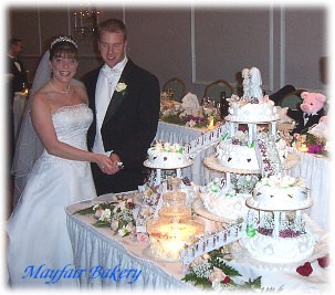 beautiful bride Beth and her wedding cake (and husband!)