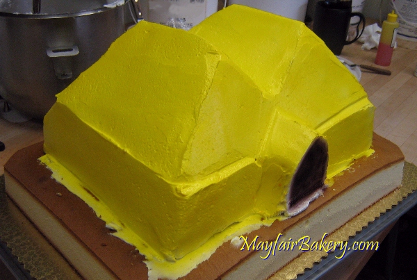 Mayfair Bakery circus tent cake getting iced