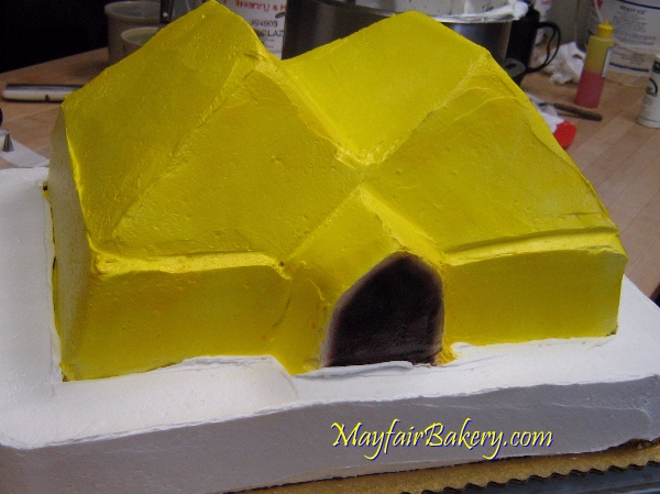 Mayfair Bakery circus tent cake getting iced